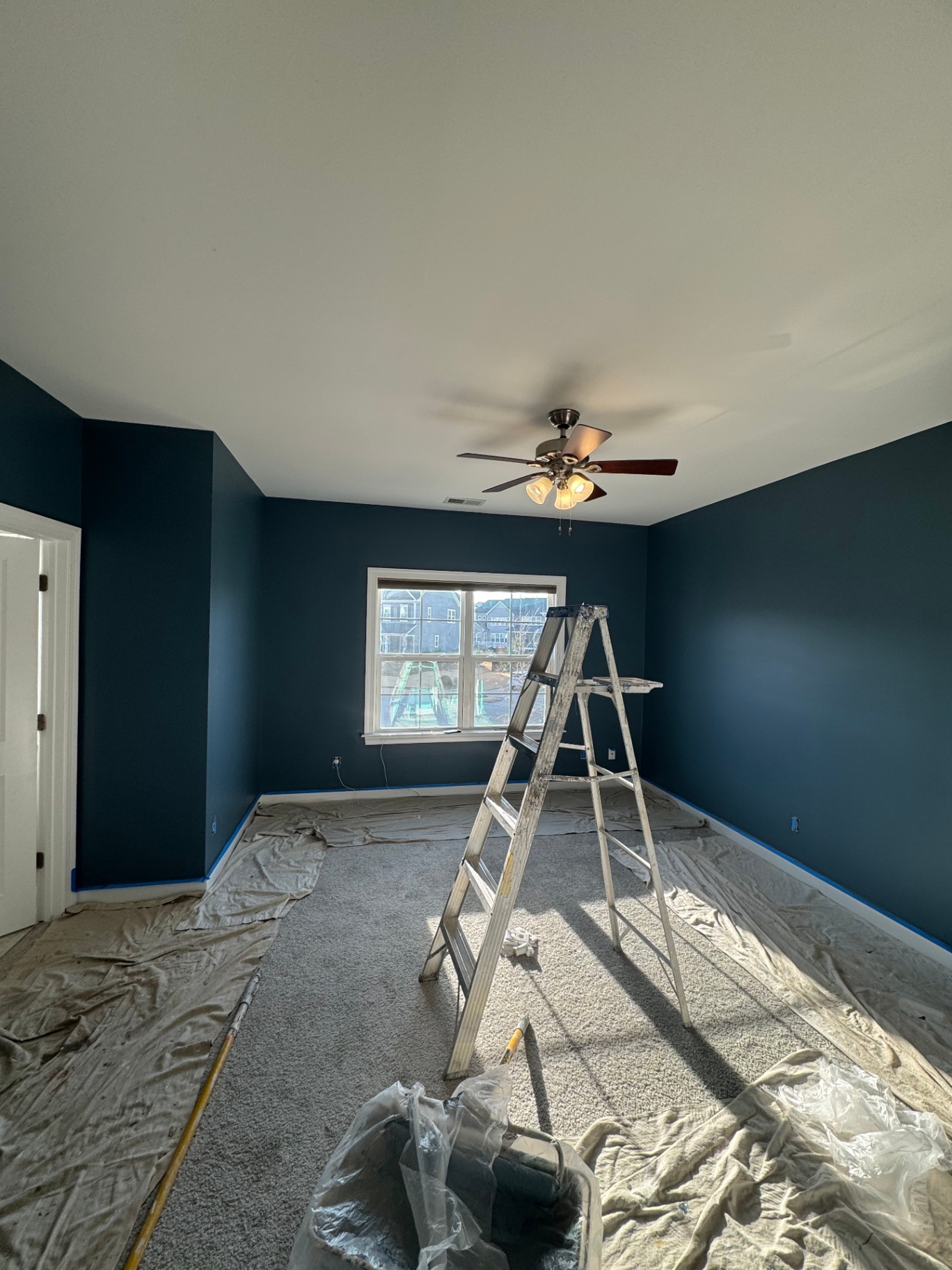 Bedroom freshly painted deep navy blue